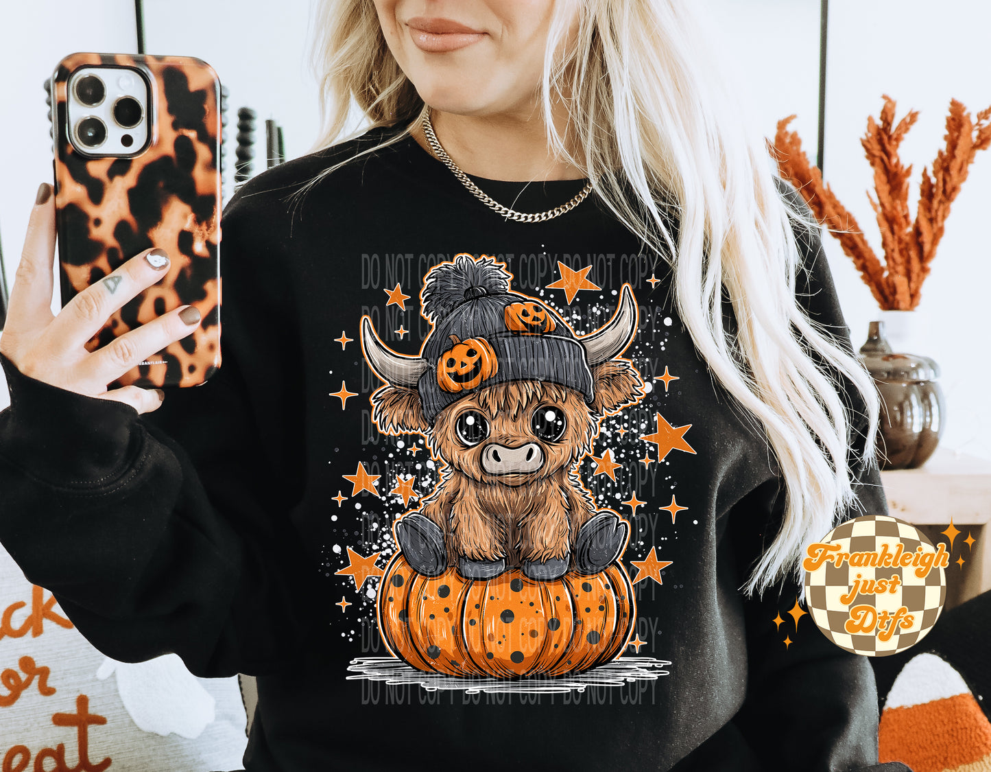 Highland cow and pumpkin